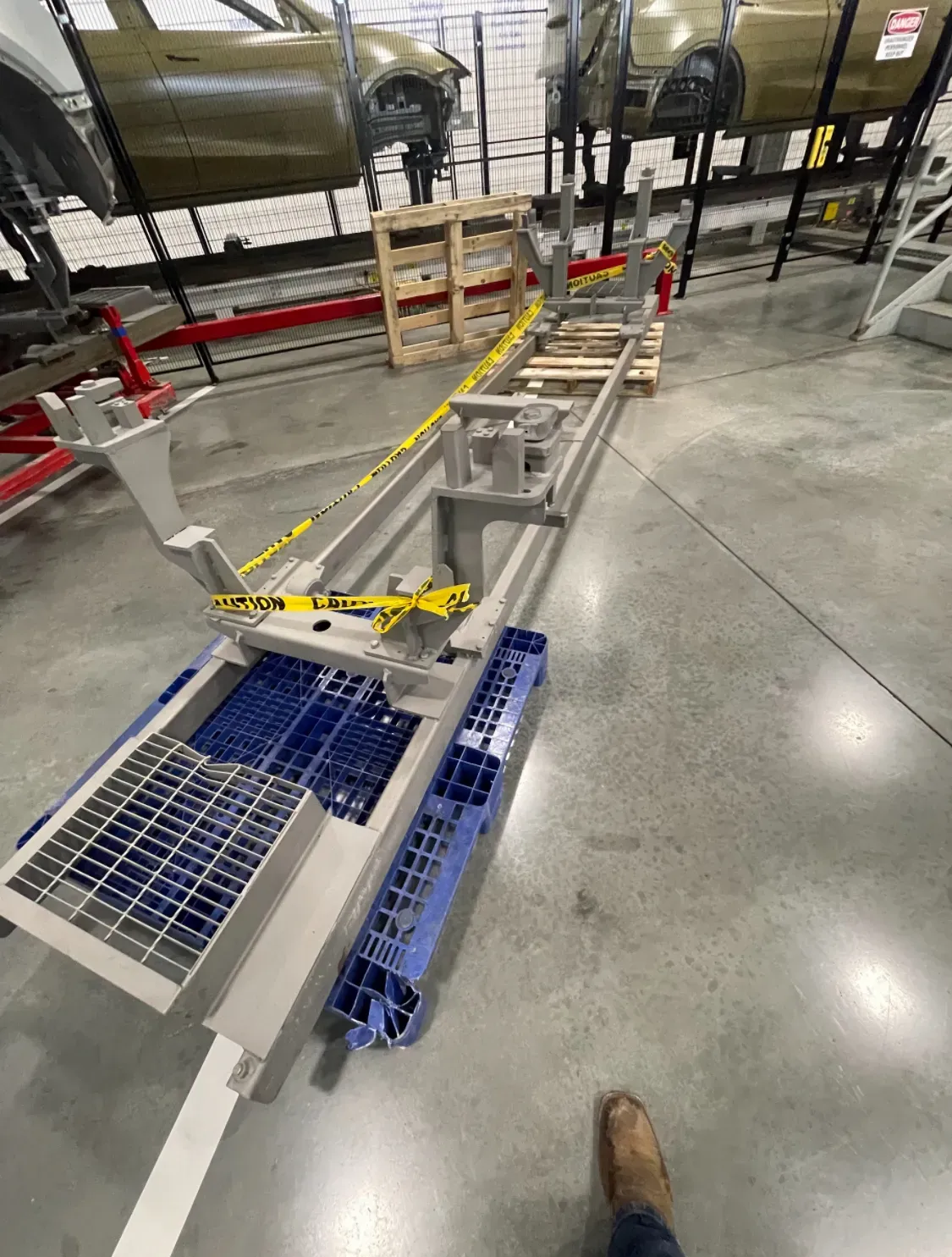 Factory floor assembly fixtures prepared for industrial surface cleaning