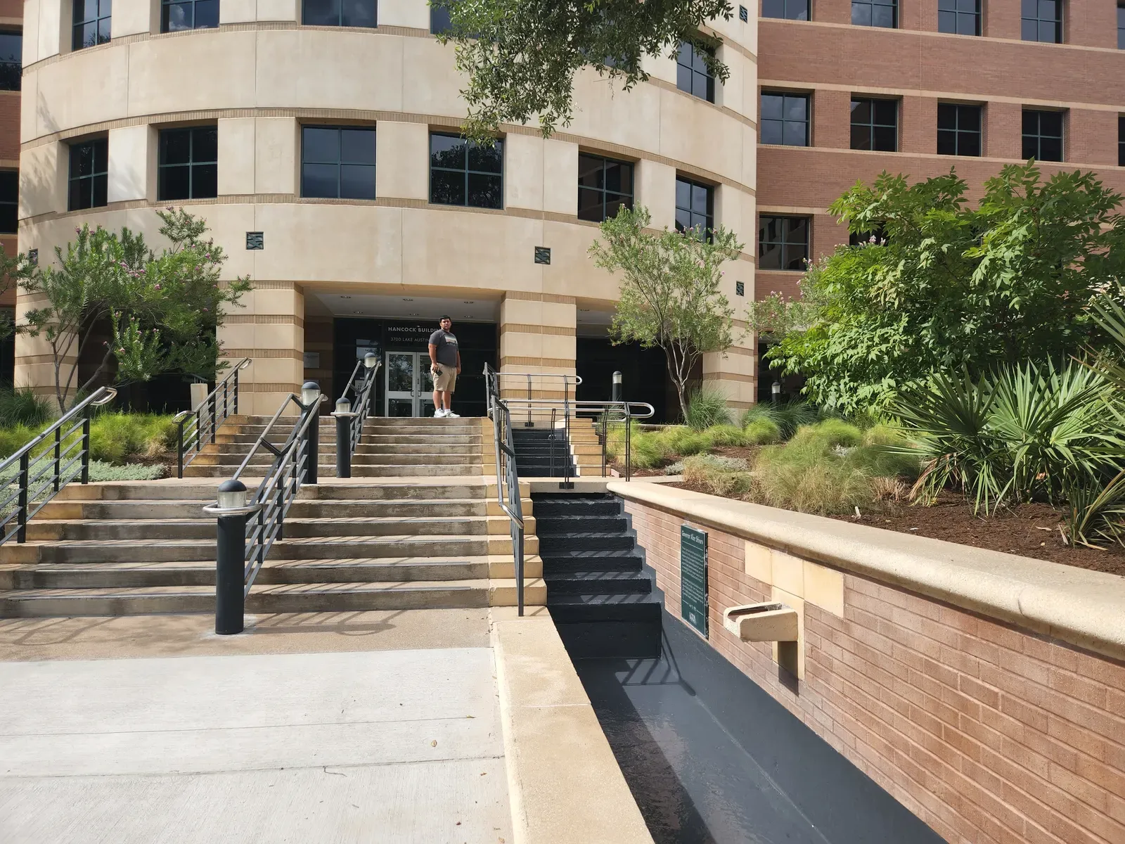 Office building entrance stairs and brick planters after sandblasting