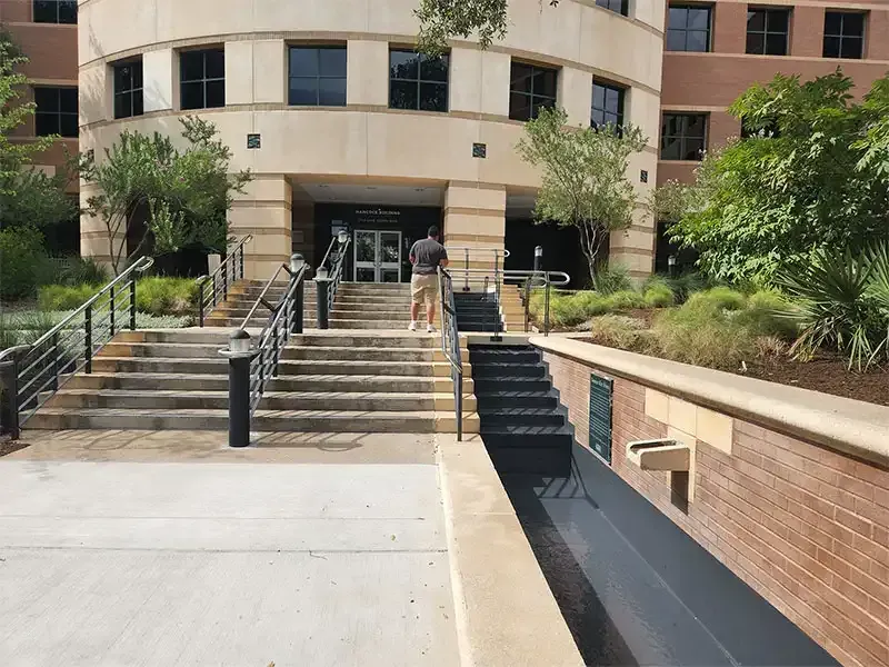 Office building entry stairs and planters after blasting and coating