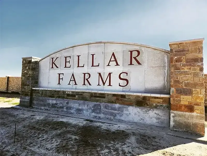 Kellar Farms stone subdivision entrance sign after cleaning