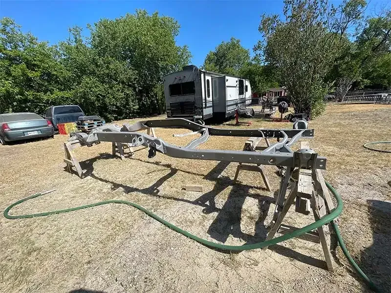 Galvanized boat trailer frame on stands after sandblasting