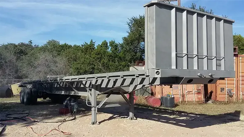 Sandblasted flatbed trailer with a steel equipment box