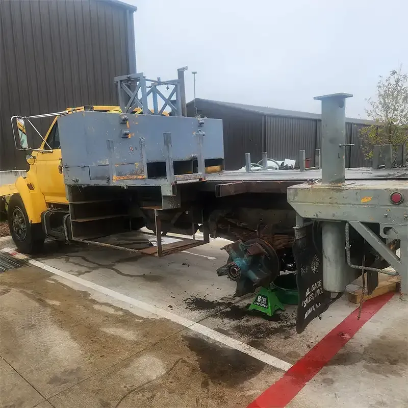 Flatbed work truck and steel equipment ready for blast cleaning