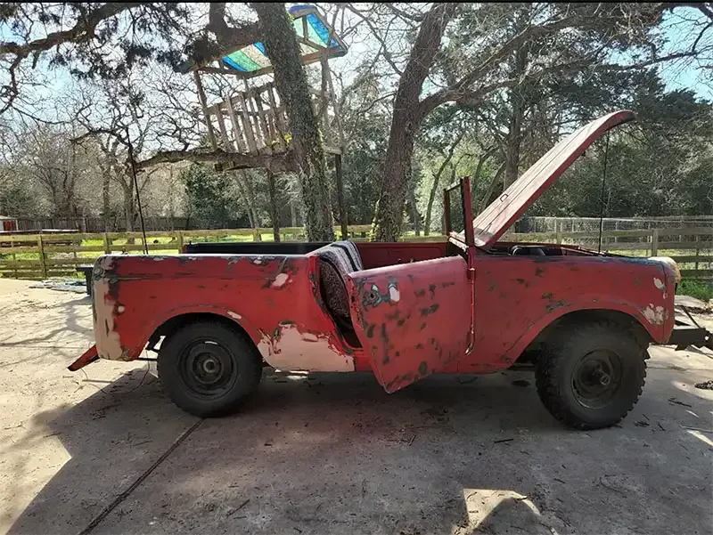 Classic red International Scout before paint-stripping sandblast