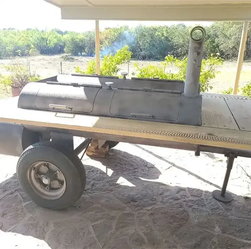 Steel smoker firebox and trailer wheel after sandblasting