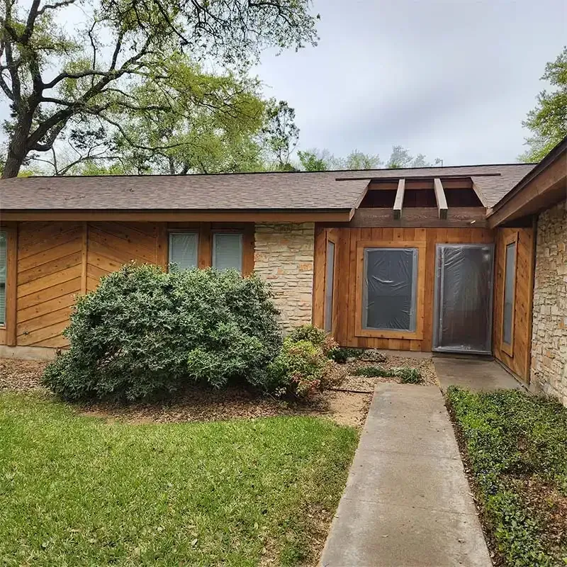 Ranch home entry with cedar siding restored after sandblasting