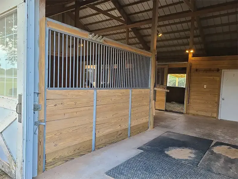 Horse barn stall with clean sandblasted wood walls