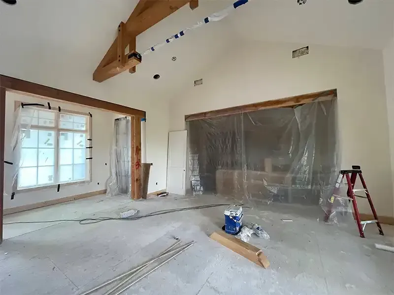 New-home interior masked in plastic for timber beam sandblasting