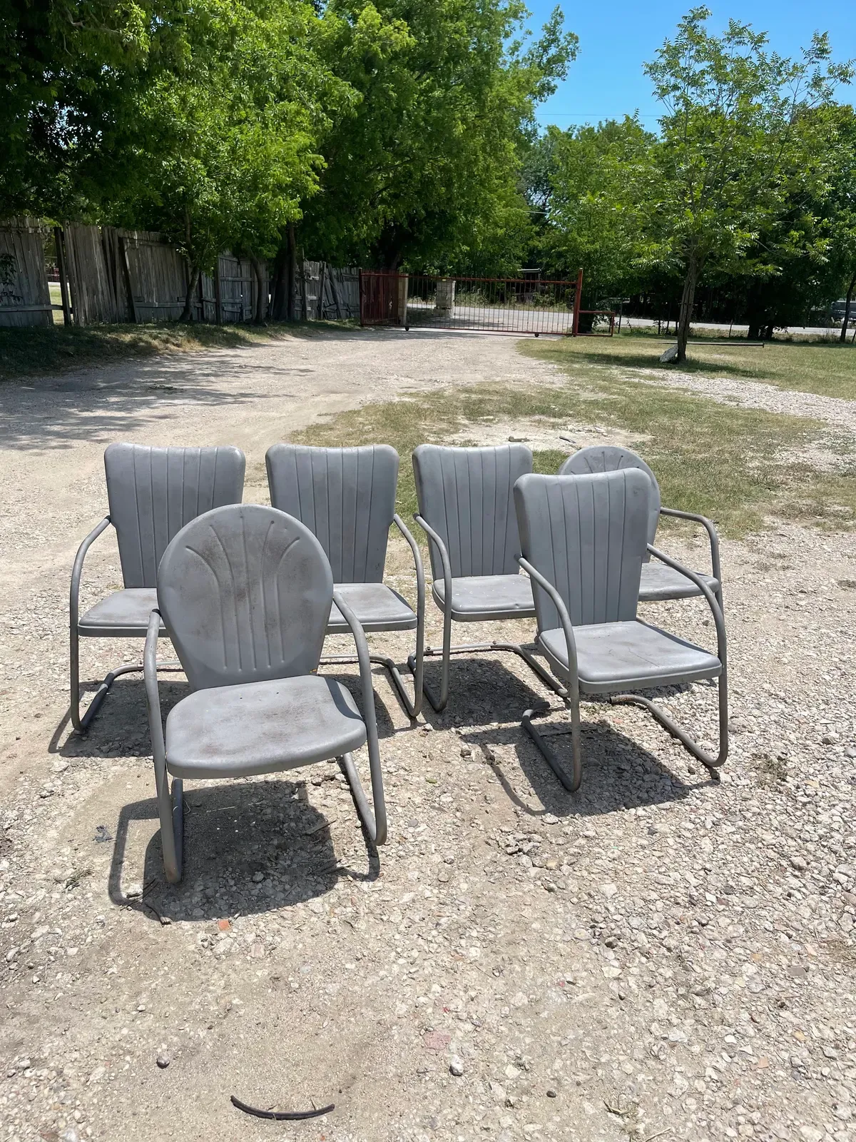 Set of vintage metal patio chairs after sandblasting and painting