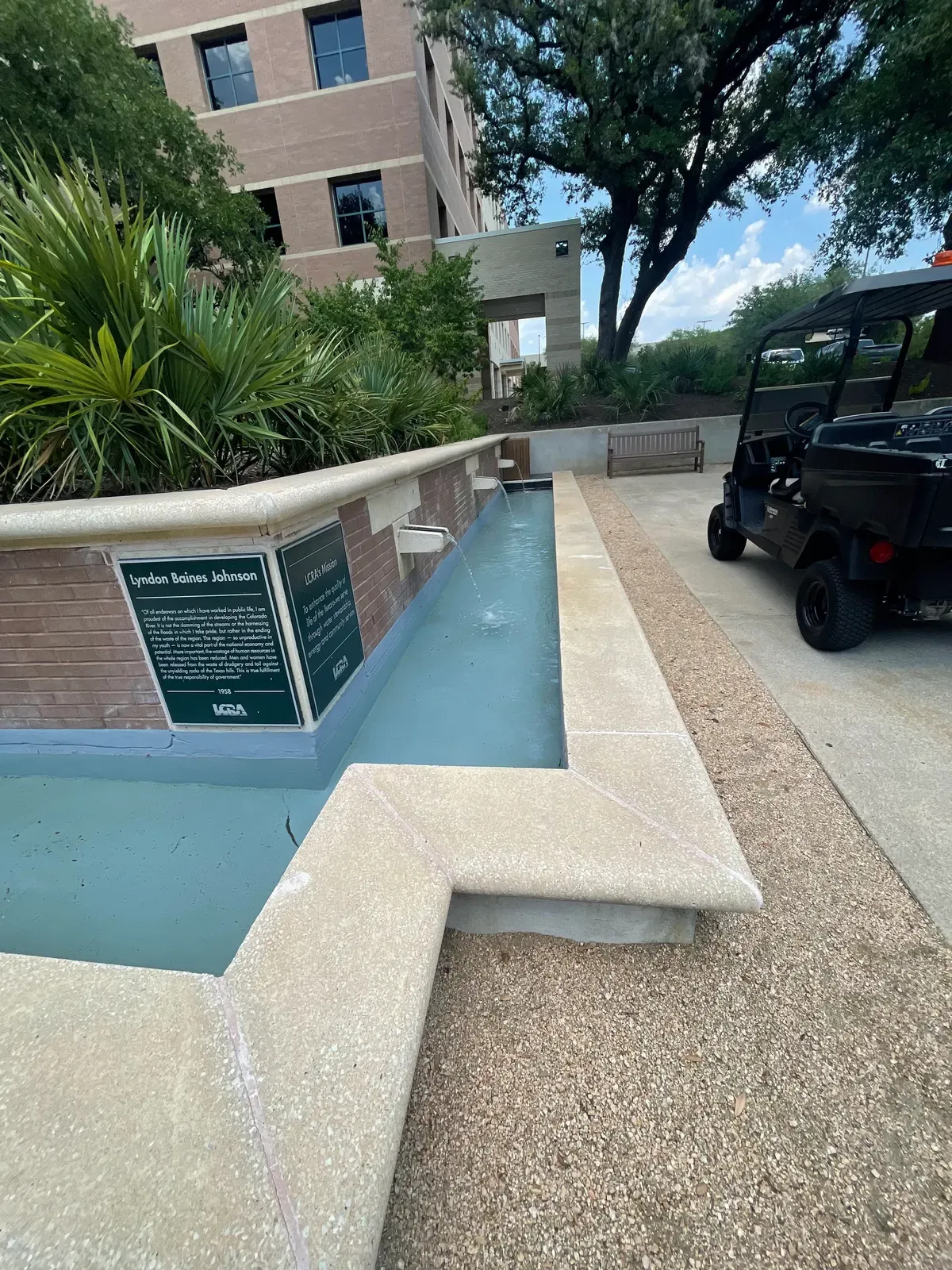 Refinished reflecting pool wall with memorial plaques