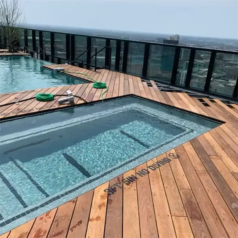 Finished rooftop pool with new wood decking above the city
