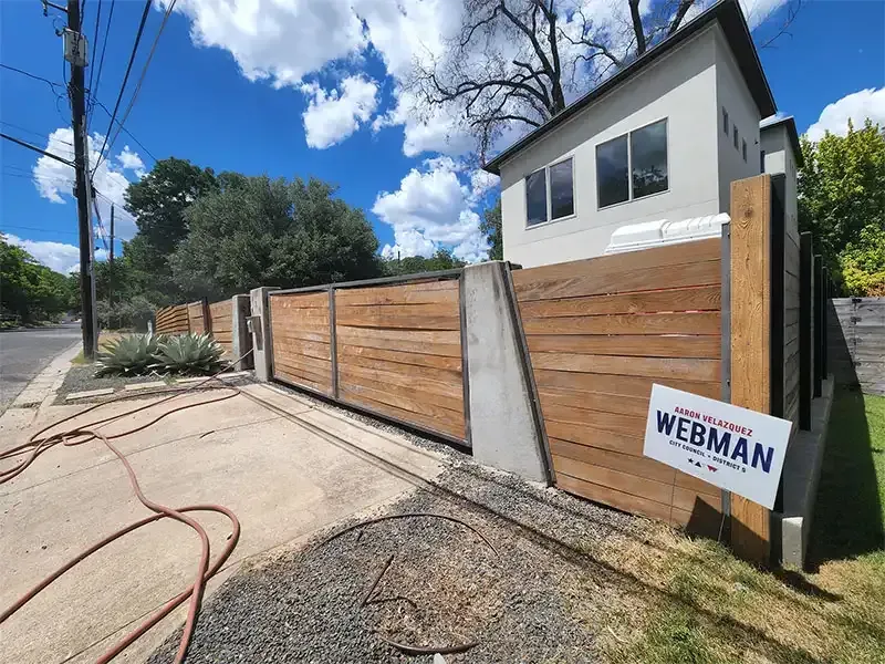 Sandblasted horizontal wood privacy fence at a modern home
