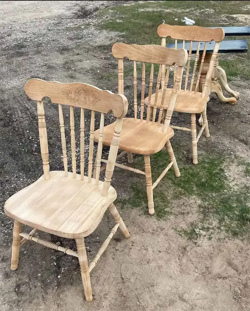 Wooden spindle-back chairs stripped to bare wood